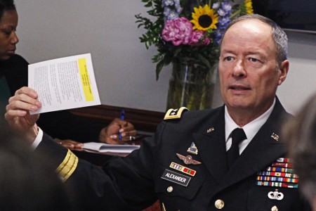 General Alexander, director of the National Security Agency and U.S. Cyber Command, gestures while speaking to reporters during the Reuters Cybersecurity Summit in Washington